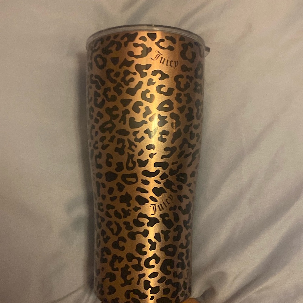 This a juicy coffee mug. It’s cheetah print, 6 inches tall 3 inches wide.